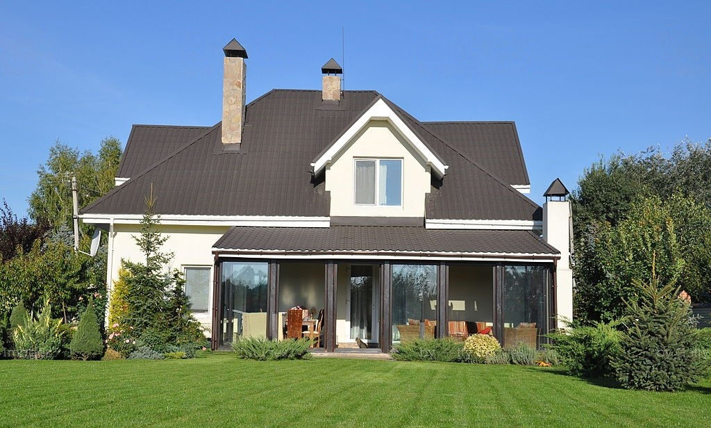 Residential home with a freshly cut, striped green lawn